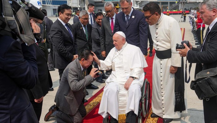 Pope Francis is assisted out of a car ahead of his departure from Jakarta Soekarno-Hatta International Airport, Indonesia, Friday, Sept. 6, 2024. Tatan Syuflana/Pool via REUTERS