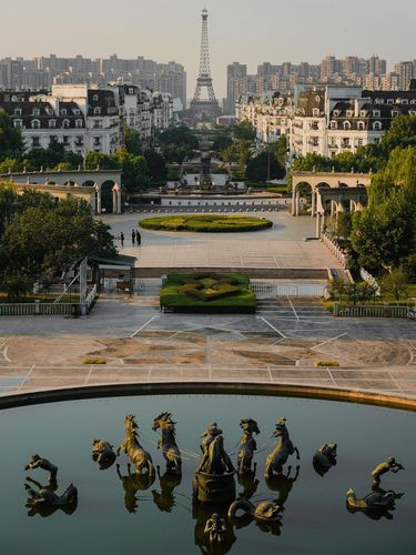 A vertical aerial of the imitations of the Eiffel tower and the Apollo Fountain sculptures in Tianducheng, China