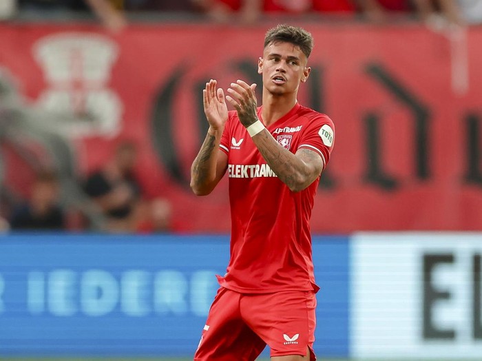 Mees Hilgers of FC Twente Enschede celebrates after scoring his teams first goal during the UEFA Champions League Third Qualification Round - Second Leg match between Twente Enschede and RB Salzburg at Grolsch Veste on August 13, 2024 in Enschede, Netherlands. (Photo by Marco Steinbrenner/DeFodi Images via Getty Images)