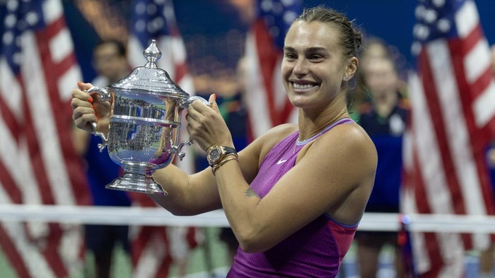 Sep 7, 2024; Flushing, NY, USA; Aryna Sabalenka celebrates with the championship trophy after her match against Jessica Pegula (USA) (not pictured) in the womens singles final of the 2024 U.S. Open tennis tournament at the USTA Billie Jean King National Tennis Center. Mandatory Credit: Mike Frey-Imagn Images
