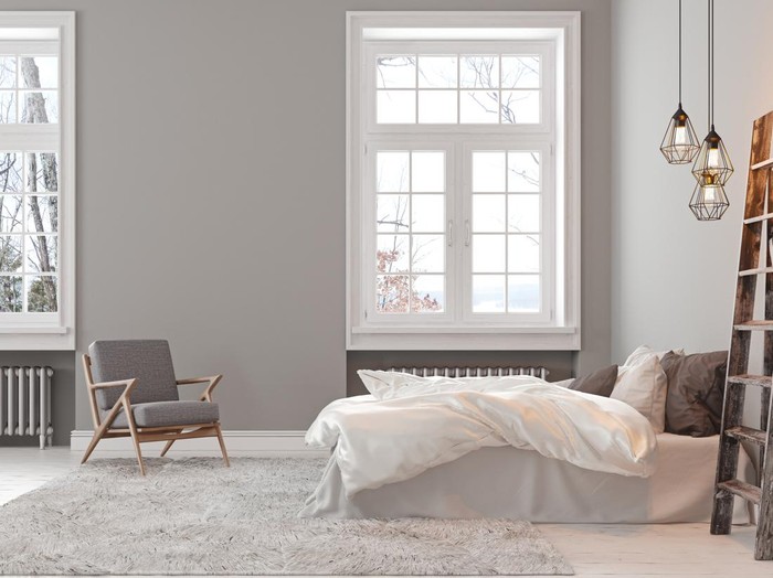 Scandinavin loft gray empty bedroom interior with armchair, bed and lamp. 3d render illustration mock up.