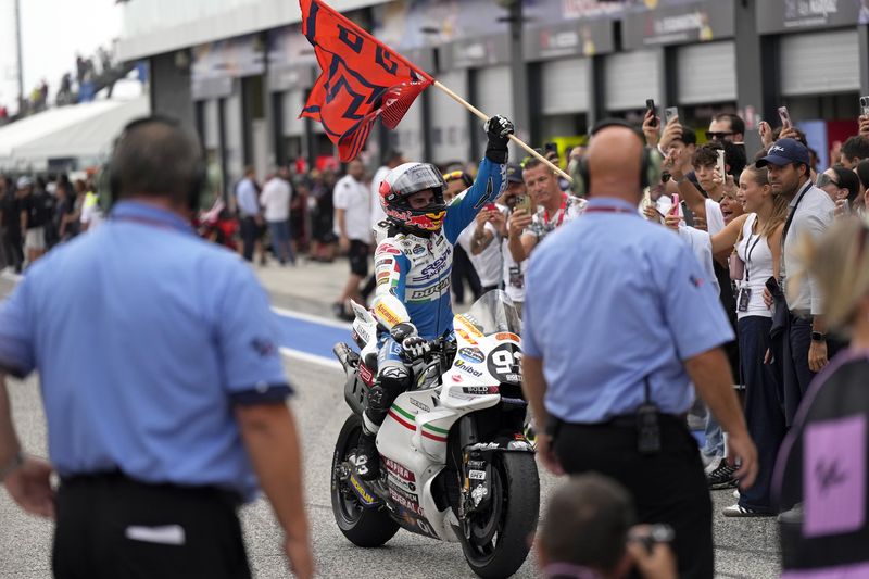 MotoGP rider Marc Marquez of Spain celebrates after winning the San Marino Motorcycle Grand Prix at the Misano circuit in Misano Adriatico, Italy, Sunday, Sept. 8, 2024. (AP Photo/Antonio Calanni)