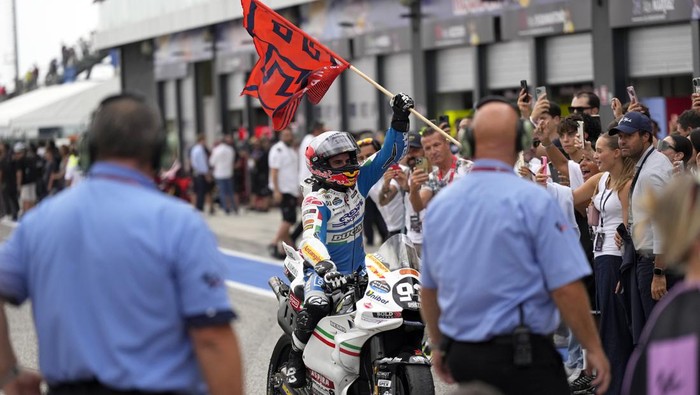 MotoGP rider Marc Marquez of Spain celebrates after winning the San Marino Motorcycle Grand Prix at the Misano circuit in Misano Adriatico, Italy, Sunday, Sept. 8, 2024. (AP Photo/Antonio Calanni)