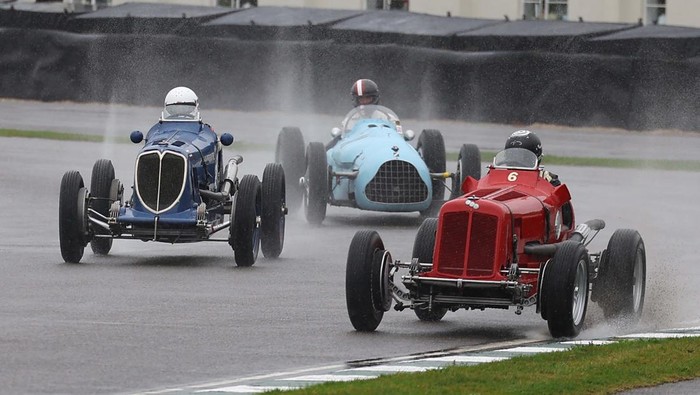 Motoring enthusiasts watch a 'drive-in' outdoor movie as they attend the Goodwood Revival, a three-day historic car racing festival in Goodwood, near Chichester, southern Britain, September 6, 2024. REUTERS/Toby Melville