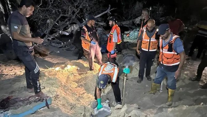 Palestinian rescuers work at the site following Israeli strikes on a tent camp sheltering displaced people, amid the Israel-Hamas conflict, at the Al-Mawasi area in Khan Younis, in the southern Gaza Strip, on September 10, 2024. (Reuters)