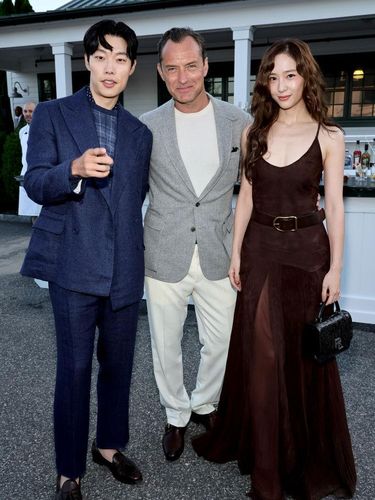 BRIDGEHAMPTON, NEW YORK - SEPTEMBER 05: (L-R) Ryu Jun-yeol, Jude Law and Krystal Jung attend Ralph Lauren fashion show during New York Fashion Week September 2024 at Khalily Stables on September 05, 2024 in Bridgehampton, New York. (Photo by Theo Wargo/Getty Images)