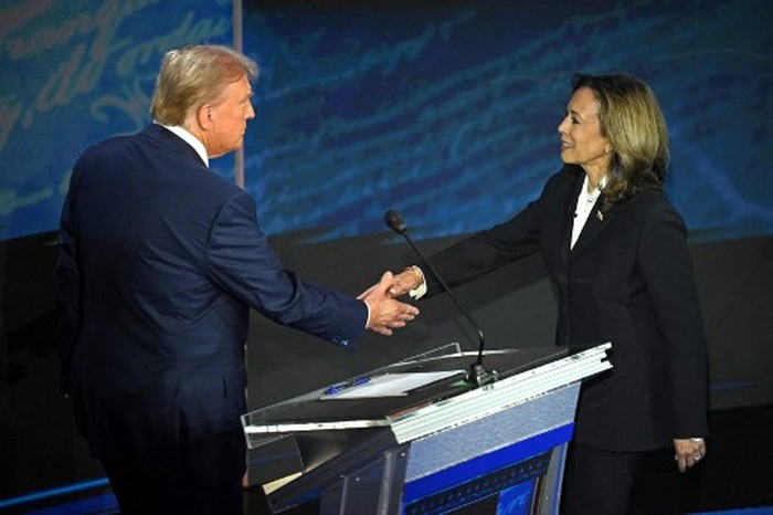 US Vice President and Democratic presidential candidate Kamala Harris (R) shakes hands with former US President and Republican presidential candidate Donald Trump during a presidential debate at the National Constitution Center in Philadelphia, Pennsylvania, on September 10, 2024. (Photo by SAUL LOEB / AFP)