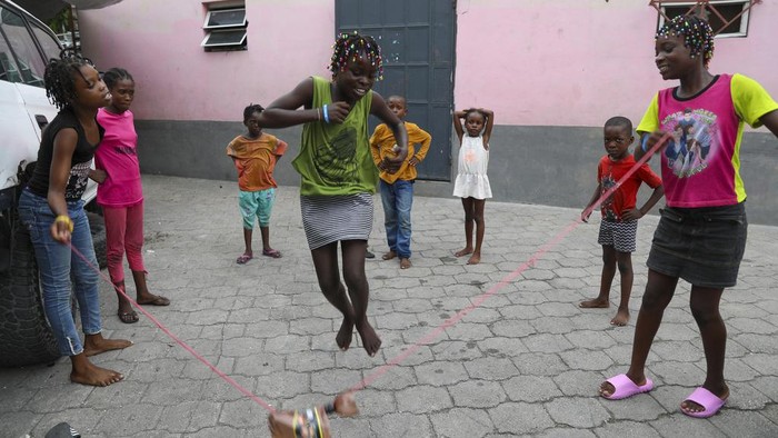 Children play soccer at a gym converted into a makeshift shelter for people displaced by gang violence in Port-au-Prince, Haiti, Wednesday, Sept. 11, 2024. (AP Photo/Odelyn Joseph)
