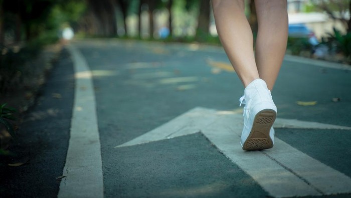 1303404564 A close up of the girls shoes walking close up.