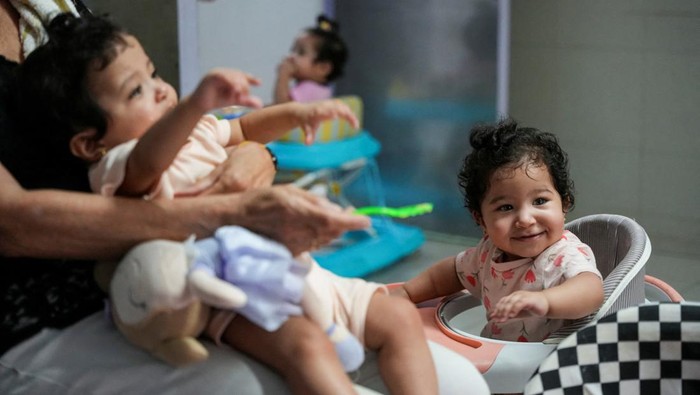 Palestinian triplets from al-Bayouk family, born prematurely and separated from their mother who had to leave them at hospital in Jerusalem to recover as she had to return to Gaza after her Israeli-issued permit expired before the ongoing Israel-Hamas conflict, are shown to their mother Hanan during a video call, at Makassed hospital in East Jerusalem September 5, 2024. Since the war began, Israel has not been issuing permits for Gaza residents to visit Jerusalem, resulting in the separation of Hanan from her triplets. REUTERS/Latifeh Abdellatif     TPX IMAGES OF THE DAY