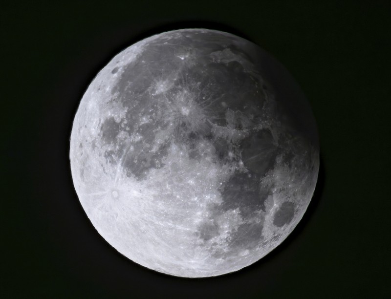A supermoon rises behind clouds over Larnaca international airport in the eastern Mediterranean island of Cyprus, on Tuesday, Sept. 17, 2024. (AP Photo/Petros Karadjias)