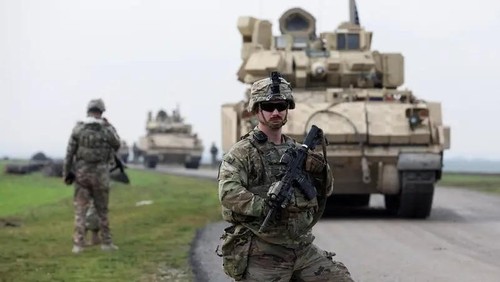 A soldier from the US-led coalition stands guard during a joint US-Kurdish-led Syrian Democratic Forces (SDF) patrol in northeastern Syria Feb. 8, 2024. (Reuters)