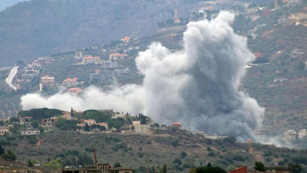 Smoke rises from the southern Lebanese village of Kfar Kila, amid ongoing cross-border hostilities between Hezbollah and Israeli forces, as pictured from Marjayoun, near the border with Israel, September 20, 2024. REUTERS/Karamallah Daher