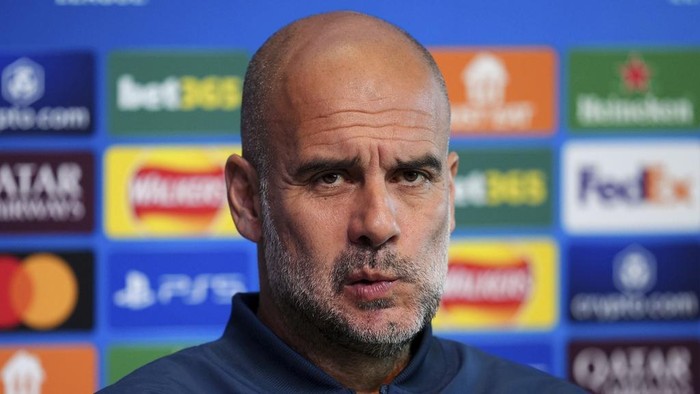 Manchester City manager Pep Guardiola attends a press conference at the City Football Academy in Manchester, England, Tuesday Sept. 17, 2024. (Martin Rickett/PA via AP)