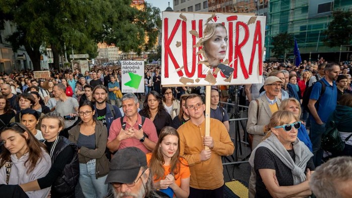 Demonstrators hold up a placard showing Slovak Cultural Minister Martina Simkovicova as they take part in a protest organized by the Open Culture platform against the current leadership of the Ministry of Culture and its interference with cultural institutions on September 19, 2024 in Bratislava, Slovakia. People in Slovakia have been protesting the changes at top cultural posts administered by Slovakias culture minister, a move that sparked outcry among artists and public figures. Martina Simkovicova has sacked heads of respected cultural institutions, including directors of the Slovak National Theatre and the Slovak National Gallery. (Photo by TOMAS BENEDIKOVIC / AFP)