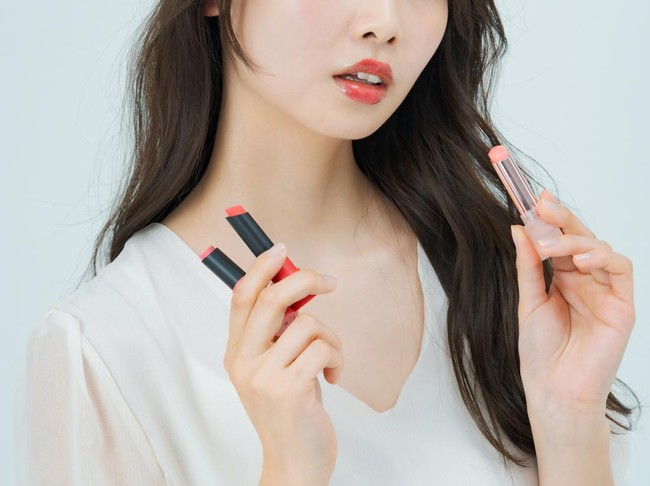 Young woman with make-up and lipstick and white background