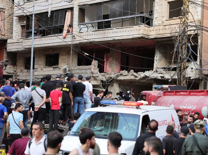 People and members of the military inspect the site of an Israeli strike in the southern suburbs of Beirut, Lebanon, September 20, 2024. REUTERS/Mohamed Azakir     TPX IMAGES OF THE DAY