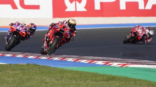 From left, Second placed Ducati rider Jorge Martin, of Spain, first placed Ducati rider Francesco Bagnaia, of Italy, and third placed Ducati rider Enea Bastianini, of Italy, compete during the MotoGP Sprint race of the Emilia Romagna Motorcycle Grand Prix at the Misano circuit in Misano Adriatico, Italy, Saturday, Sept. 21, 2024. (AP Photo/Gregorio Borgia)