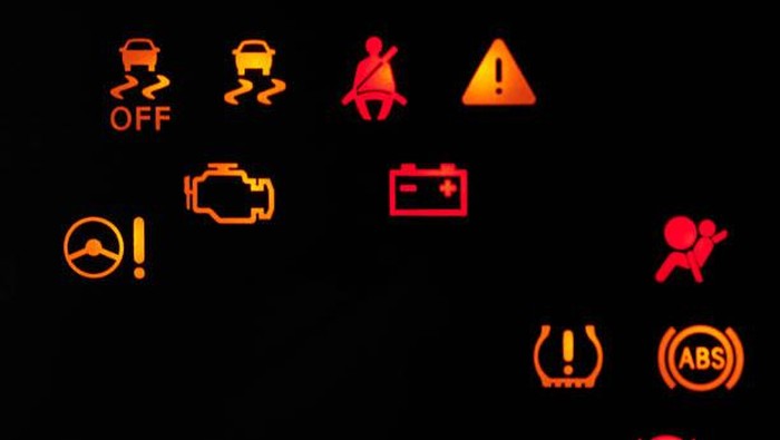 Car alert icons lamp on dashboard close up view