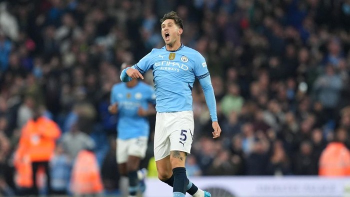Manchester Citys John Stones celebrates scoring their sides second goal of the game during the Premier League match at the Etihad Stadium, Manchester. Picture date: Sunday September 22, 2024. (Photo by Martin Rickett/PA Images via Getty Images)