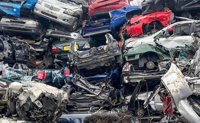 DEVIZES, ENGLAND - NOVEMBER 29: End of life petrol and diesel cars and vans are piled on top of one another as they wait to be recycled in a car scrapyard on November 29, 2022 in Glastonbury, England. The UK scraps over one million cars a year and many more petrol and diesel cars will need to be taken off the road if the Government is to reach its target for the number of electric cars to be reached.(Photo by Matt Cardy/Getty Images)