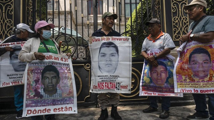 Hooded students throw explosives at the Ministry of the Interior during demonstrations ahead of the 10th anniversary of the disappearance of 43 Ayotzinapa in Guerrero state, in Mexico City, Monday, Sept. 23, 2024. (AP Photo/Felix Marquez)