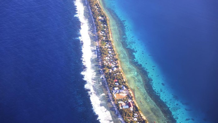 Aerial view of Funafuti, Tuvalu’s most populous island, showing the port and main town of Fongafale, September 6, 2024. Picture taken through plane window. REUTERS/Kirsty Needham