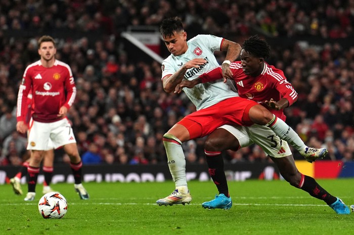 Manchester Uniteds Kobbie Mainoo (right) and Twentes Mees Hilgers battle for the ball during the UEFA Europa League match at Old Trafford, Manchester. Picture date: Wednesday September 25, 2024. (Photo by Martin Rickett/PA Images via Getty Images)