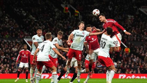Manchester Uniteds Diogo Dalot (right) attempts a headed shot towards goal during the UEFA Europa League match at Old Trafford, Manchester. Picture date: Wednesday September 25, 2024. (Photo by Martin Rickett/PA Images via Getty Images)