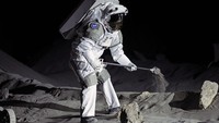 An astronaut cheers with ESA director Josef Aschbacher after a training in lunar surface simulating conditions for future moon missions, like the Artemis lunar exploration program led by NASA, at the opening of the new LUNA facility at the European Astronaut Center, near Cologne, Germany, Wednesday, Sept. 25, 2024. (AP Photo/Martin Meissner)