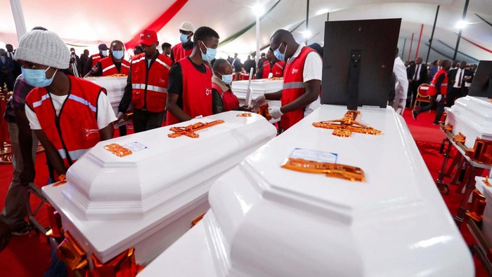 Candles representing the deceased children are lit near the coffins before a memorial service for the pupils who died after a fatal fire at the Hillside Endarasha Academy within Kieni in Nyeri County, Kenya September 26, 2024. REUTERS/Thomas Mukoya