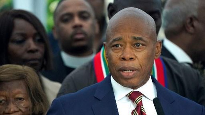 New York City Mayor Eric Adams talks to the press outside  Gracie Mansion, the official residence of the mayor of New York City, on September 26, 2024, after he was indicted on federal criminal charges. US federal agents raided the official residence of Mayor Adams early September 26 ahead of the expected announcement of criminal charges against the former city cop once touted as a rising Democratic Party star. The search at the residence known as Gracie Mansion began before dawn, and is the latest shock twist in a graft investigation against the Adams administration. (Photo by TIMOTHY A. CLARY / POOL / AFP)