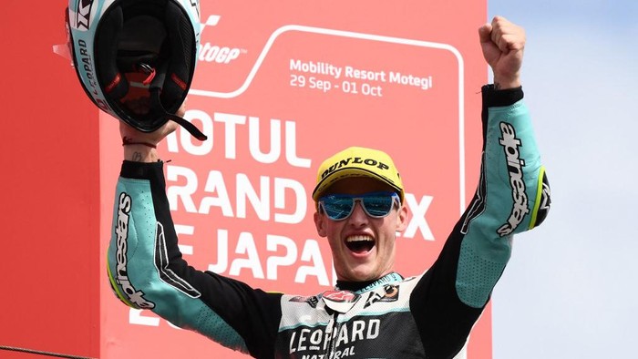 Leopard Racing rider Jaume Masia of Spain celebrates his victory on the Moto3 class race podium of MotoGP Japanese Grand Prix at the Mobility Resort Motegi in Motegi, Tochigi prefecture on October 1, 2023. (Photo by Toshifumi KITAMURA / AFP)