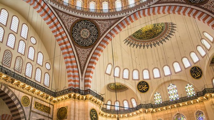 Hagia Sophia (Aya Sofya) indoors captured with fish-eye lens. Warm tone given. Unrecognizable people visible.See more Istanbul