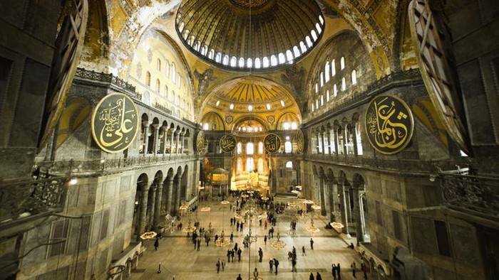 Hagia Sophia (Aya Sofya) indoors captured with fish-eye lens. Warm tone given. Unrecognizable people visible.See more Istanbul