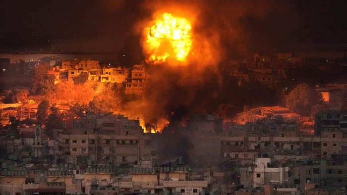 Flames rise after an Israeli airstrike in the southern suburbs of Beirut, Lebanon, Saturday, Sept. 28, 2024. (AP Photo/Hussein Malla)