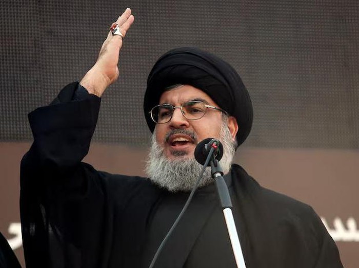 Lebanons Hezbollah leader Sayyed Hassan Nasrallah addresses his supporters during a religious procession to mark Ashura in Beiruts suburbs November 14, 2013. REUTERS/Khalil Hassan/File Photo Purchase Licensing Rights