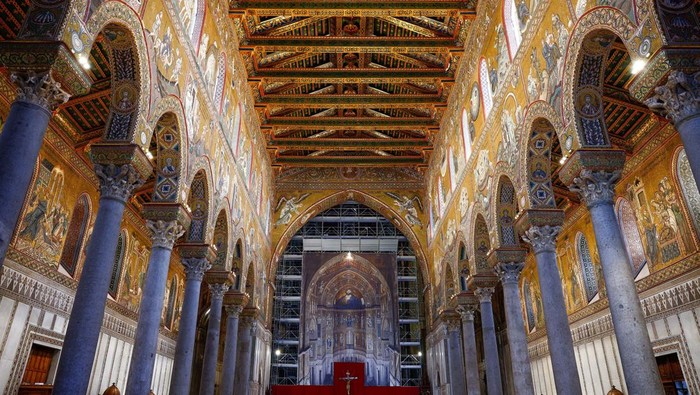 Golden mosaics are seen on the ceiling and behind the scaffolding inside the Monreale Cathedral, a UNESCO World Heritage site that combines Western, Islamic and Byzantine styles, in Monreale, Sicily, Italy, August 25, 2024. REUTERS/Guglielmo Mangiapane