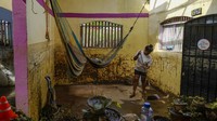 John mengakibatkan banjir dan tanah longsor mematikan, yang menewaskan 22 orang. (AP Photo/Felix Marquez)