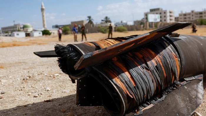 A projectile lies on the ground a day after Iran fired a salvo of ballistic missiles against Israel, in Jericho, in the Israeli-occupied West Bank October 2, 2024. REUTERS/Mohammed Torokman