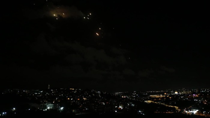 HERZLIYA, ISRAEL - OCTOBER 01: A view of a giant hole as Israeli forces arrive in the area and investigate debris of missiles fired from Iran towards Israel, after they fall in Herzliya, north of Tel Aviv, Israel on October 01, 2024. The Israeli military reported that missiles were launched from Iran towards Israel, triggering sirens throughout the country, particularly in Tel Aviv. Saeed Qaq / AnadoluNo Use USA No use UK No use Canada No use France No use Japan No use Italy No use Australia No use Spain No use Belgium No use Korea No use South Africa No use Hong Kong No use New Zealand No use Turkey