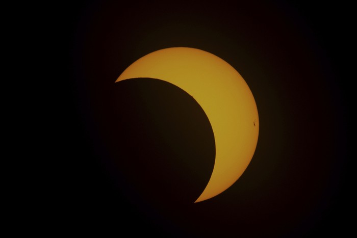 The moon moves across the sun during an annular solar eclipse seen from Tahai, Rapa Nui, or Easter Island, Chile, Wednesday, Oct. 2, 2024. (AP Photo/Esteban Felix)