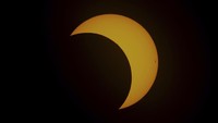 The moon moves across the sun during an annular solar eclipse seen from Tahai, Rapa Nui, or Easter Island, Chile, Wednesday, Oct. 2, 2024. (AP Photo/Esteban Felix)