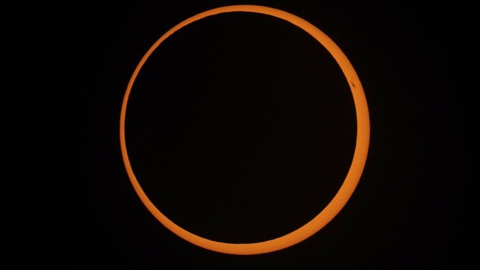 The moon moves across the sun during an annular solar eclipse seen from Tahai, Rapa Nui, or Easter Island, Chile, Wednesday, Oct. 2, 2024. (AP Photo/Esteban Felix)