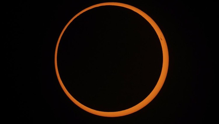 The moon moves across the sun during an annular solar eclipse seen from Tahai, Rapa Nui, or Easter Island, Chile, Wednesday, Oct. 2, 2024. (AP Photo/Esteban Felix)