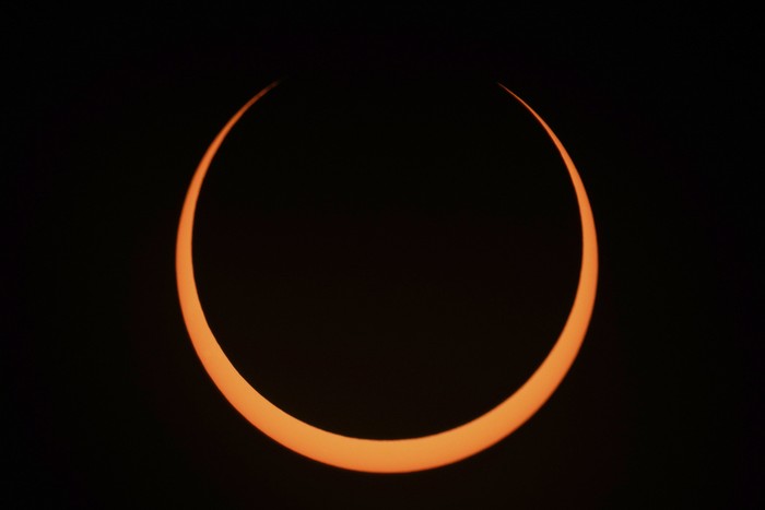 The moon moves across the sun during an annular solar eclipse seen from Tahai, Rapa Nui, or Easter Island, Chile, Wednesday, Oct. 2, 2024. (AP Photo/Esteban Felix)