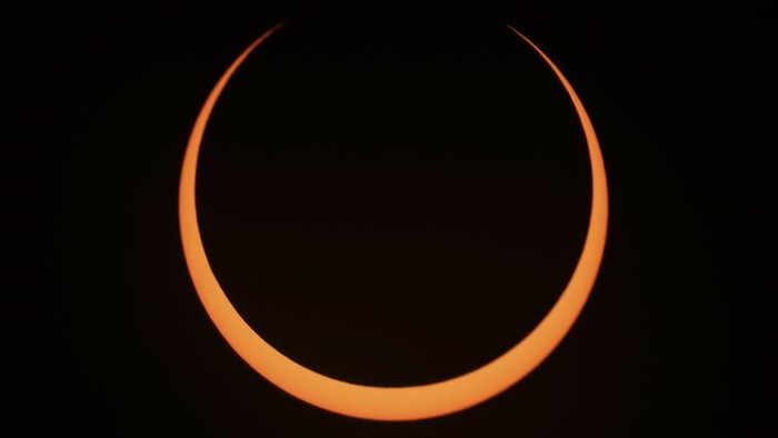 The moon moves across the sun during an annular solar eclipse seen from Tahai, Rapa Nui, or Easter Island, Chile, Wednesday, Oct. 2, 2024. (AP Photo/Esteban Felix)