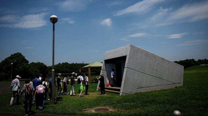 Members of the Tokyo Metropolitan Government Bureau of Construction conduct a visit inside Kanda River Ring Road No.7 Underground Regulating Reservoir, constructed to protect Tokyo and its suburbs against floods during heavy rain and typhoon seasons, in Tokyo, Japan, July 16, 2024. The system kicked in four times in June, more than all of last year, capturing water before pumping it safely into the Edogawa River and out to sea. 