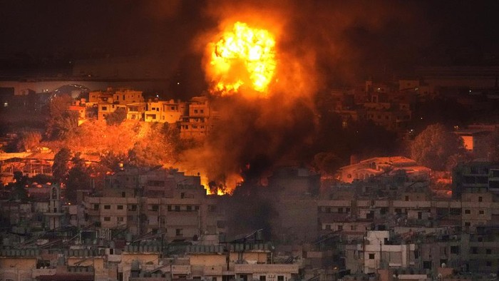 Flames rise after an Israeli airstrike in the southern suburbs of Beirut, Lebanon, Saturday, Sept. 28, 2024. (AP Photo/Hussein Malla)