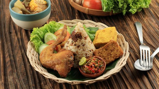 Nasi Tutug Oncom, Traditional Sundanese Meal Rice Mixed with Oncom Fermented Soybean Products, Served with Various Side Dish